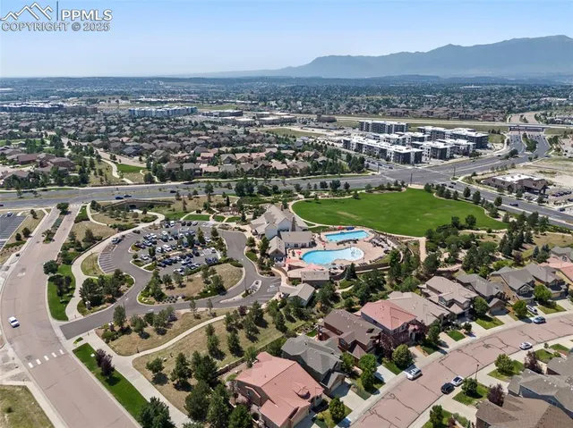 an aerial view of a house with outdoor space