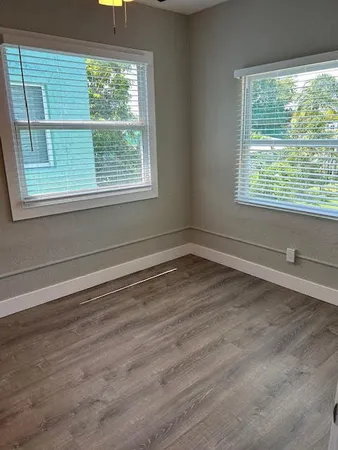 a view of a room that has a window in it