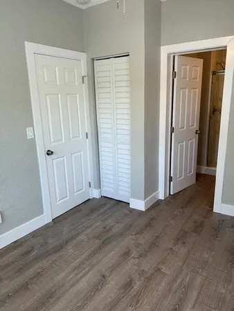 an empty room with wooden floor