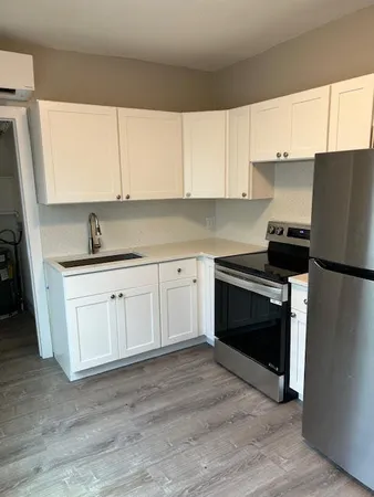 a kitchen with a sink and a stove