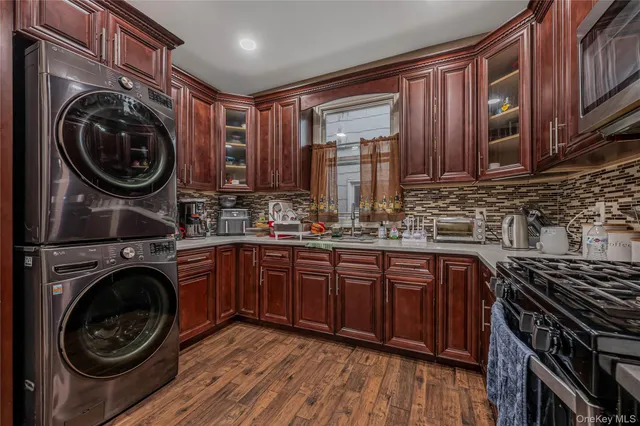 a kitchen with wooden cabinets and a stove top oven