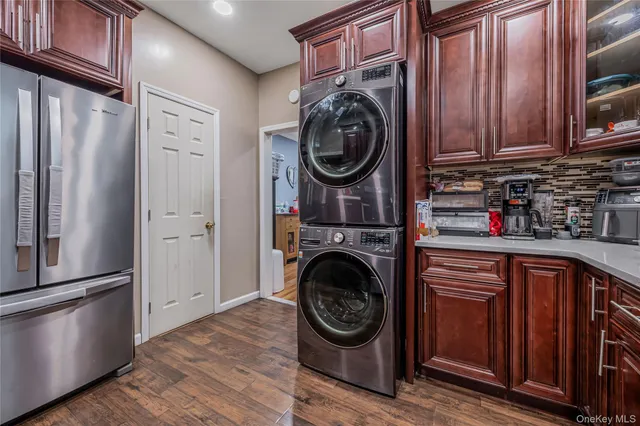 a utility room with sink dryer and washer