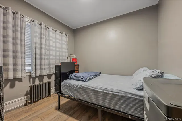 a bedroom with a bed and a table in it