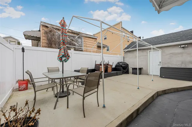 a view of a chairs and table in a patio