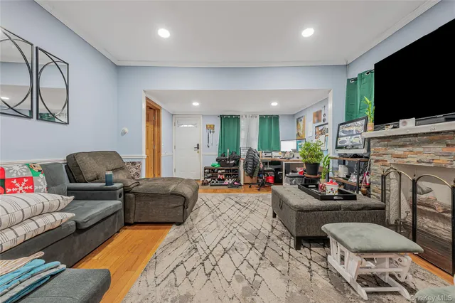 a living room with fireplace furniture and a flat screen tv