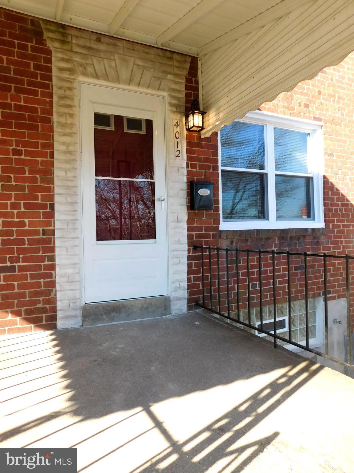 4012 Rexmere Road Baltimore, MD 21218 - Photo 1 of 29 a view of a brick house with a large window