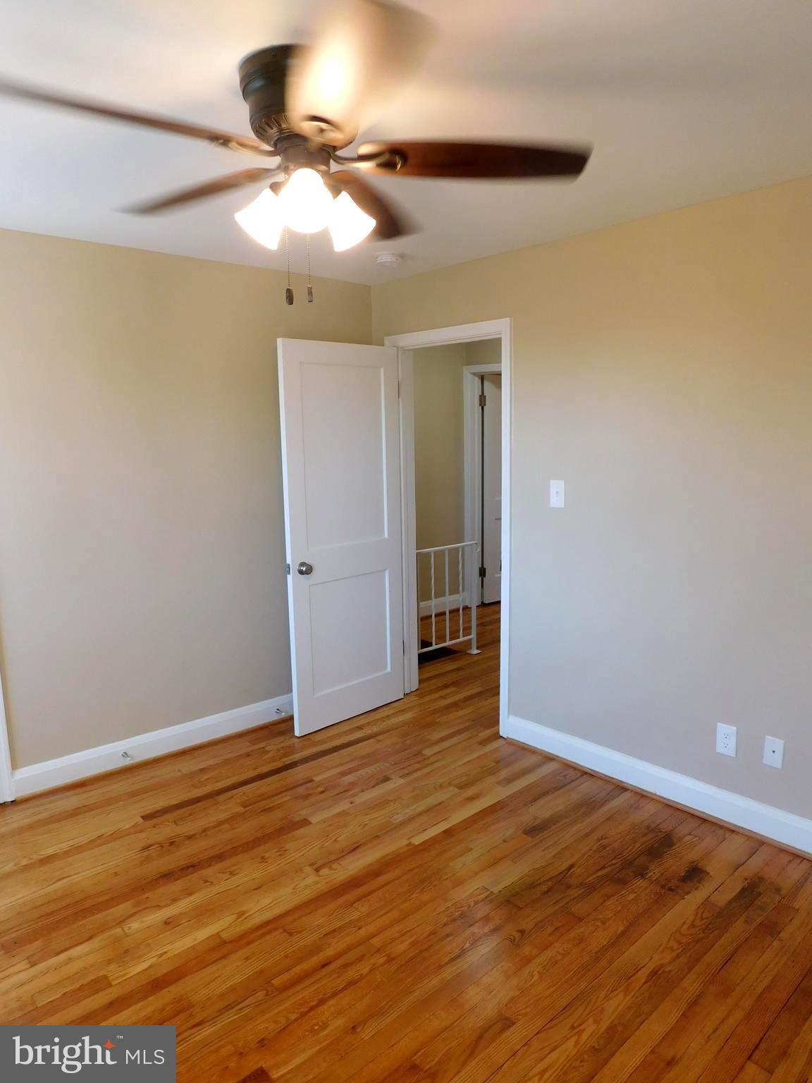 4012 Rexmere Road Baltimore, MD 21218 - Photo 13 of 29 wooden floor in an empty room