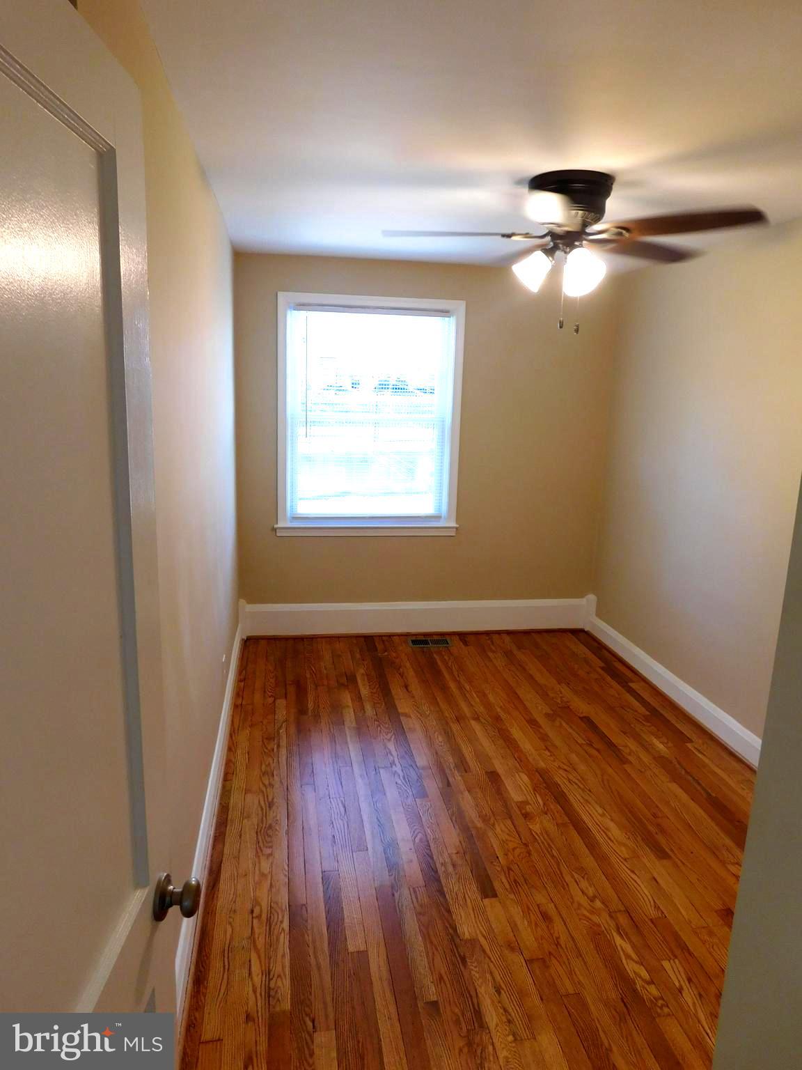 4012 Rexmere Road Baltimore, MD 21218 - Photo 15 of 29 a view of empty room with wooden floor