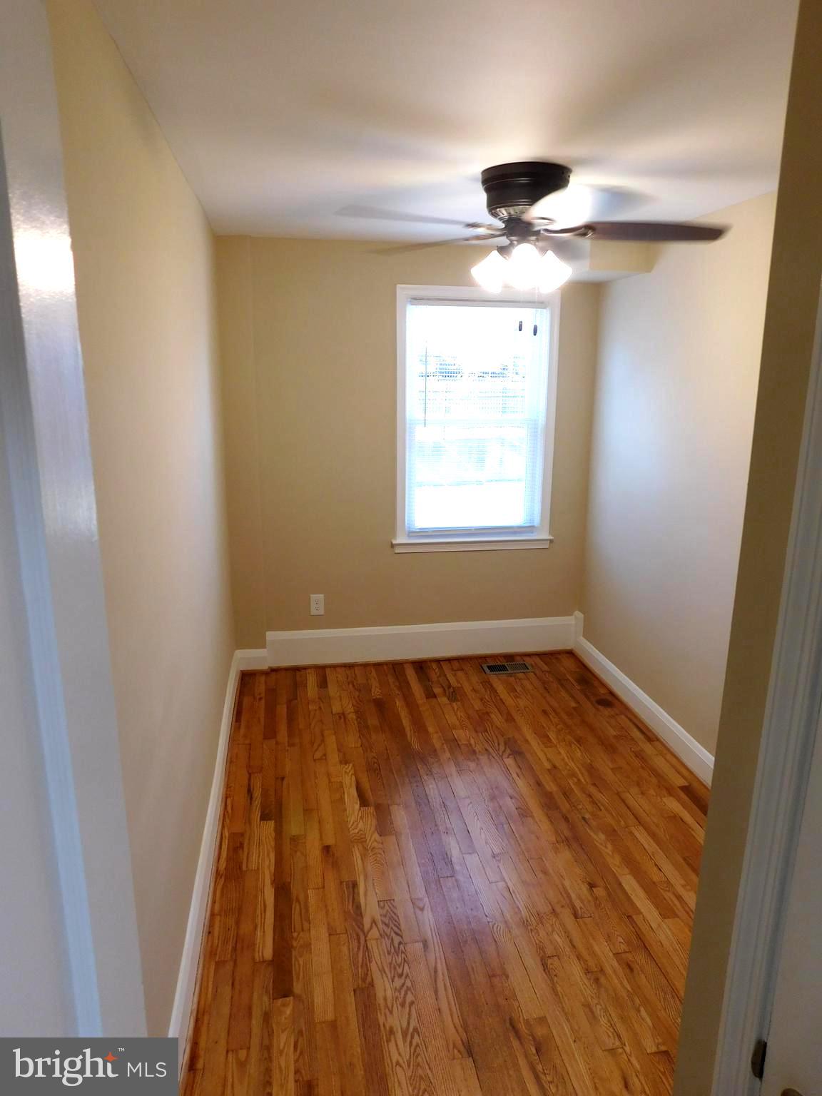 4012 Rexmere Road Baltimore, MD 21218 - Photo 18 of 29 wooden floor in an empty room and a window