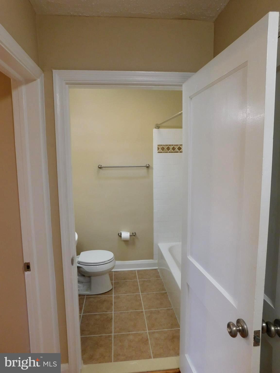 4012 Rexmere Road Baltimore, MD 21218 - Photo 20 of 29 a bathroom with a toilet and a shower
