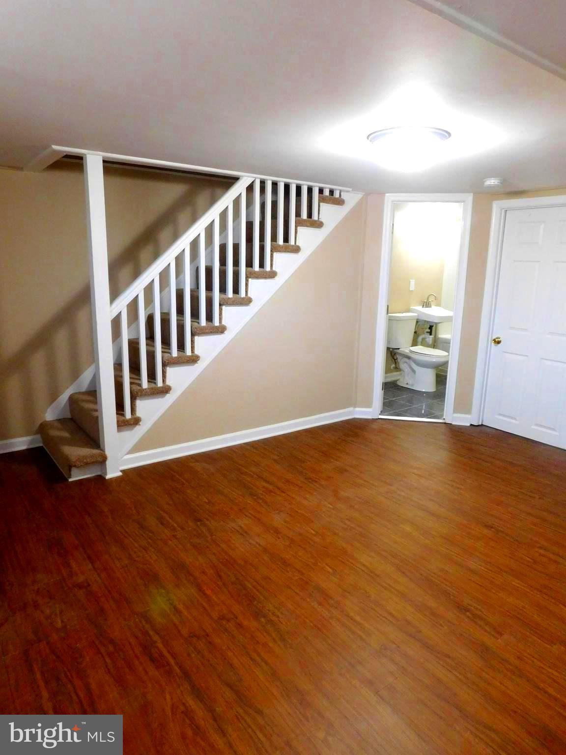 4012 Rexmere Road Baltimore, MD 21218 - Photo 24 of 29 a view of an empty room with wooden floor