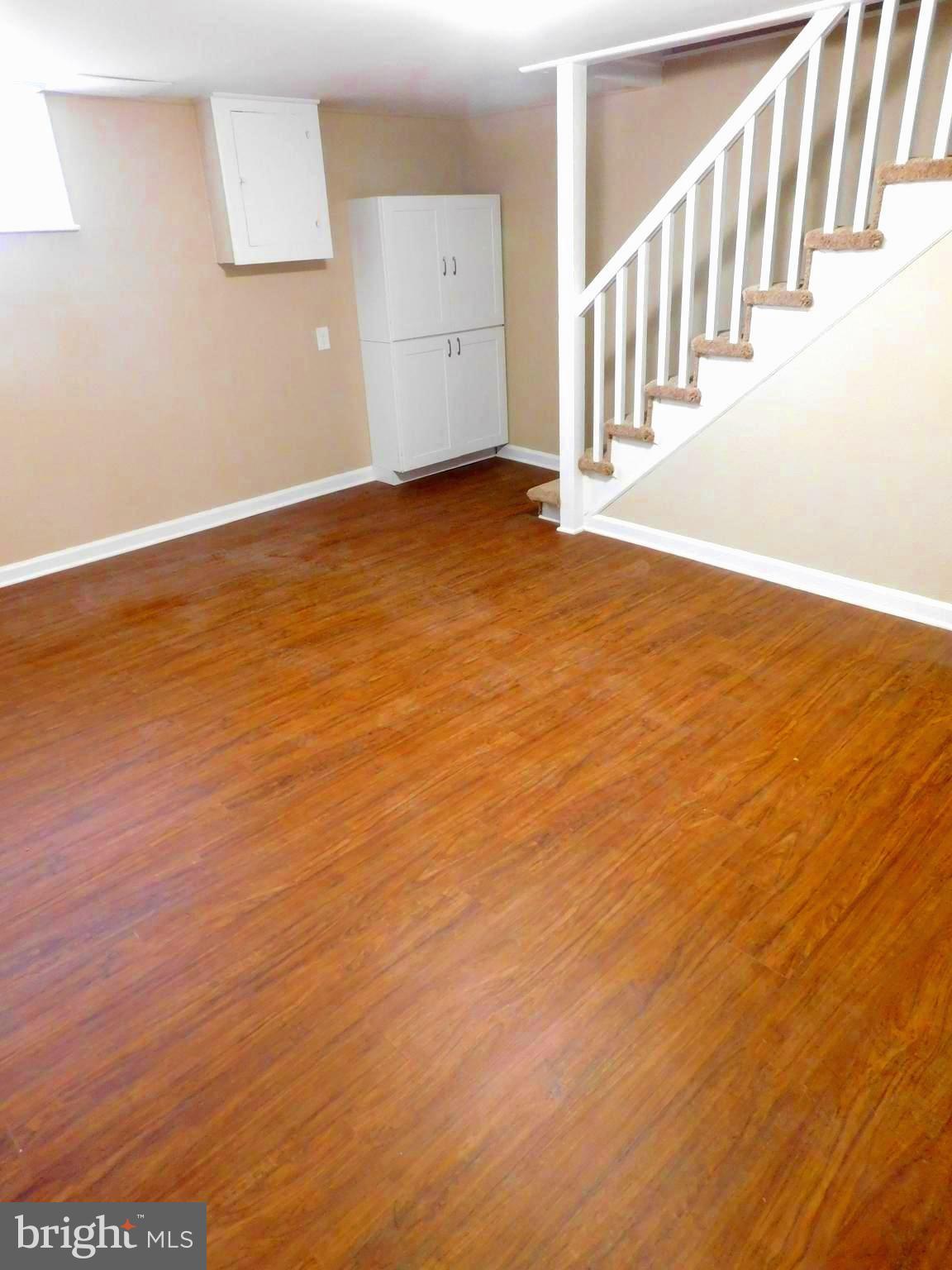 4012 Rexmere Road Baltimore, MD 21218 - Photo 25 of 29 a view of an empty room with stairs