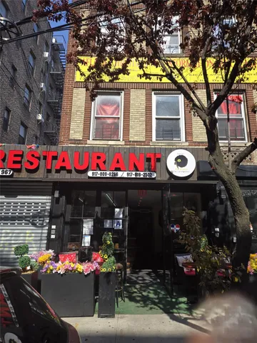 a front view of a building with retail shops