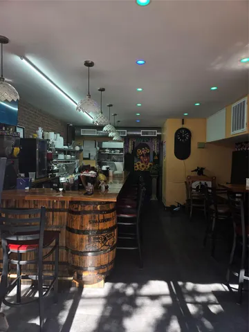 a bathroom with a toilet a sink and a mirror