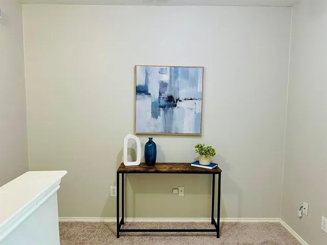 a room with a sink and a mirror