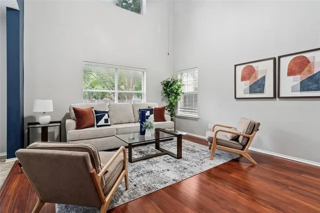 a living room with furniture and a window
