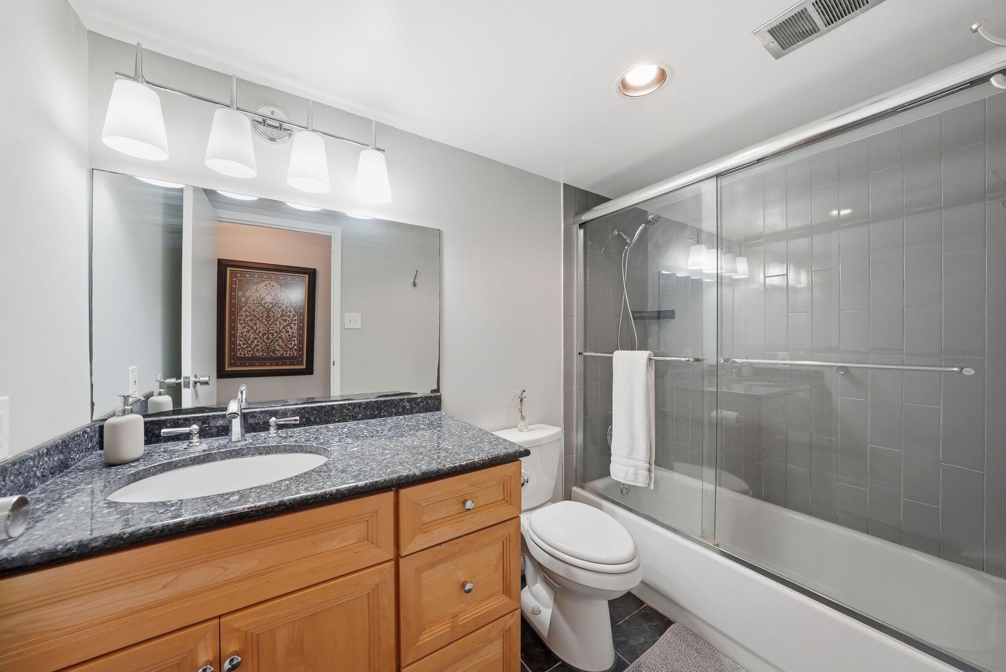 11252 Chestnut Grove Square, Unit 248 Reston, VA 20190 - Photo 13 of 25 1st modern bathroom with sleek finishes.