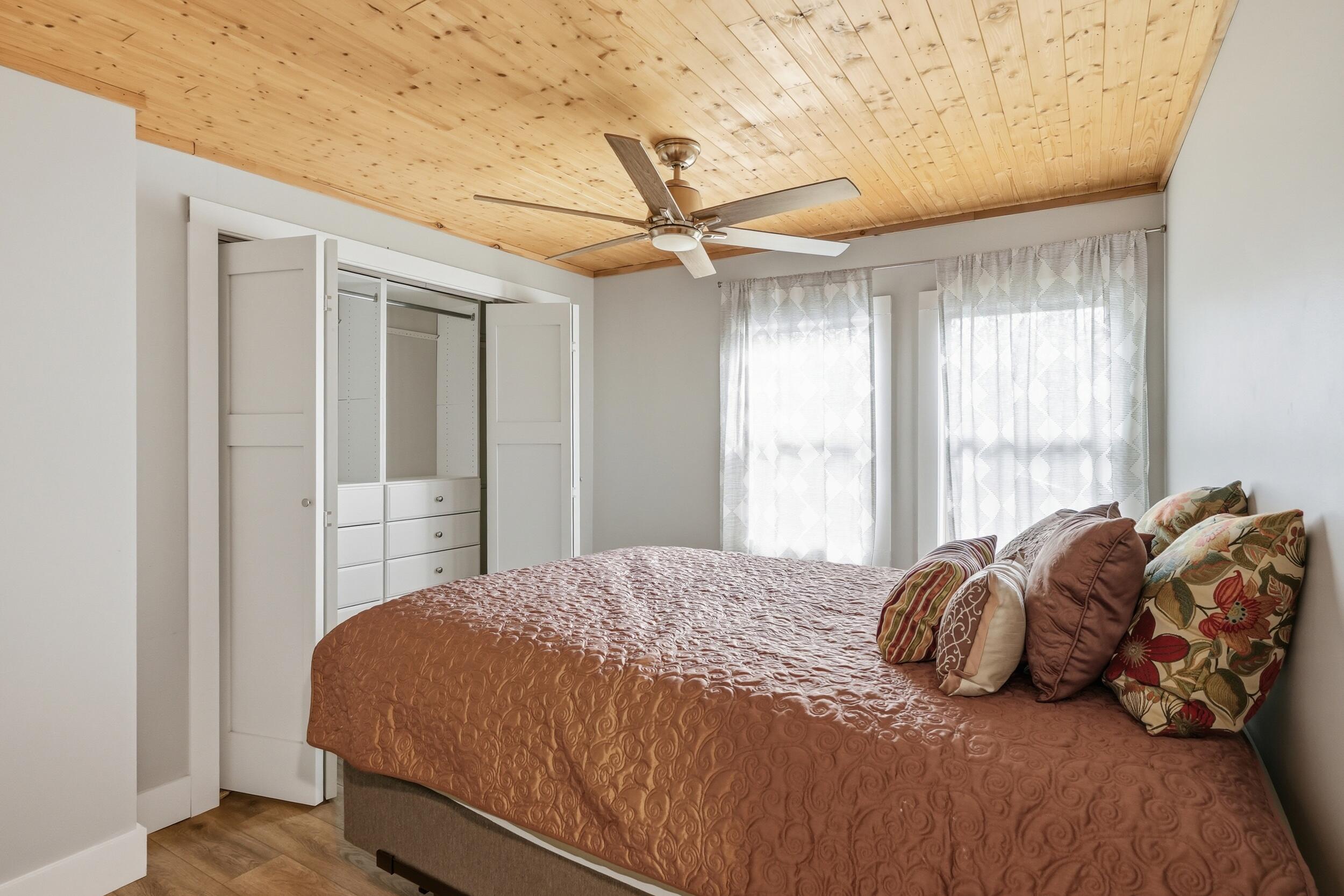 1307 Redwing Road Valparaiso, IN 46383 - Photo 11 of 20 a bedroom with a bed and a chandelier