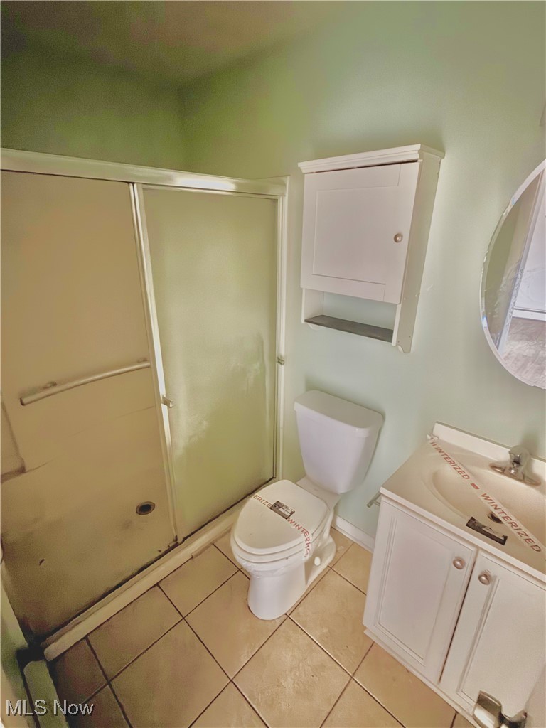 2898 Canton Road Uniontown, OH 44685 - Photo 16 of 20 Bathroom with vanity, a stall shower, and light tile patterned flooring
