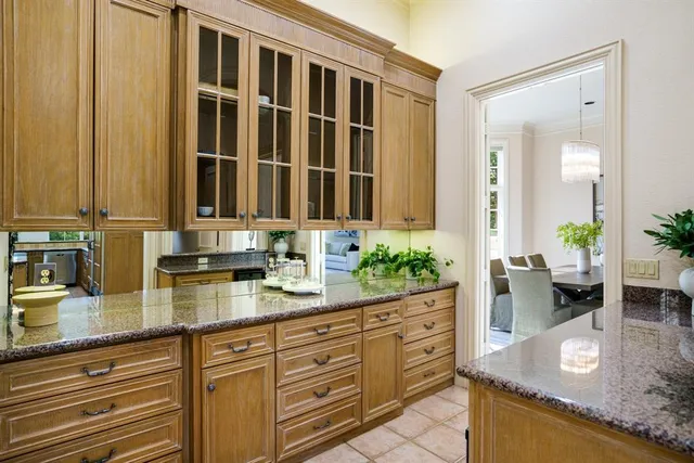 a kitchen with sink and cabinets