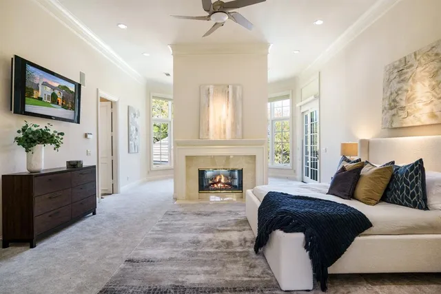 a bedroom with a bed and a fireplace