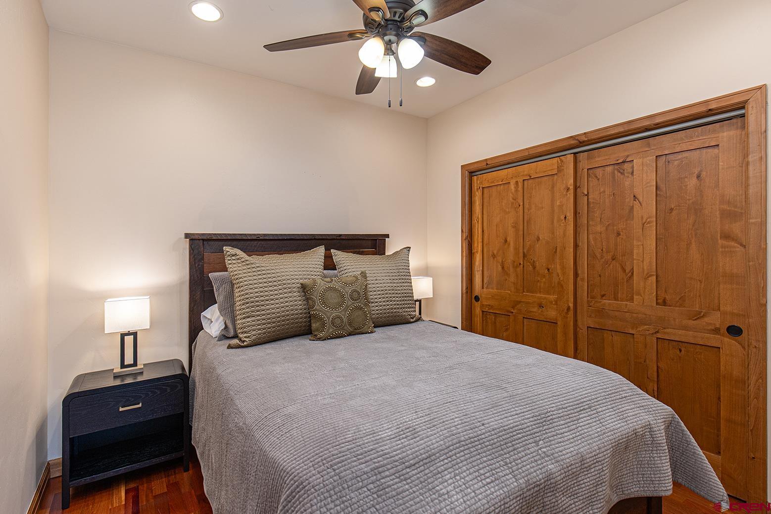 1099 Main Avenue, Unit 410 Durango, CO 81301 - Photo 12 of 34 a bedroom with a bed and a closet
