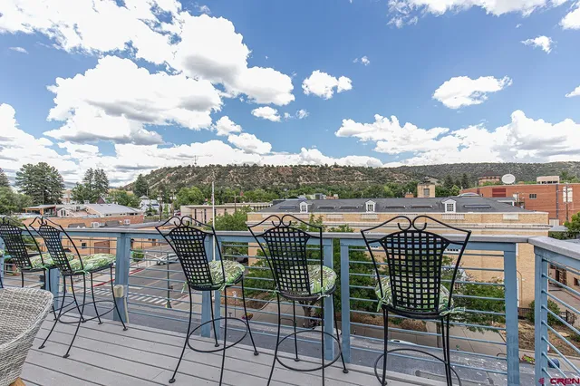 a view of a chairs and table in the terrace