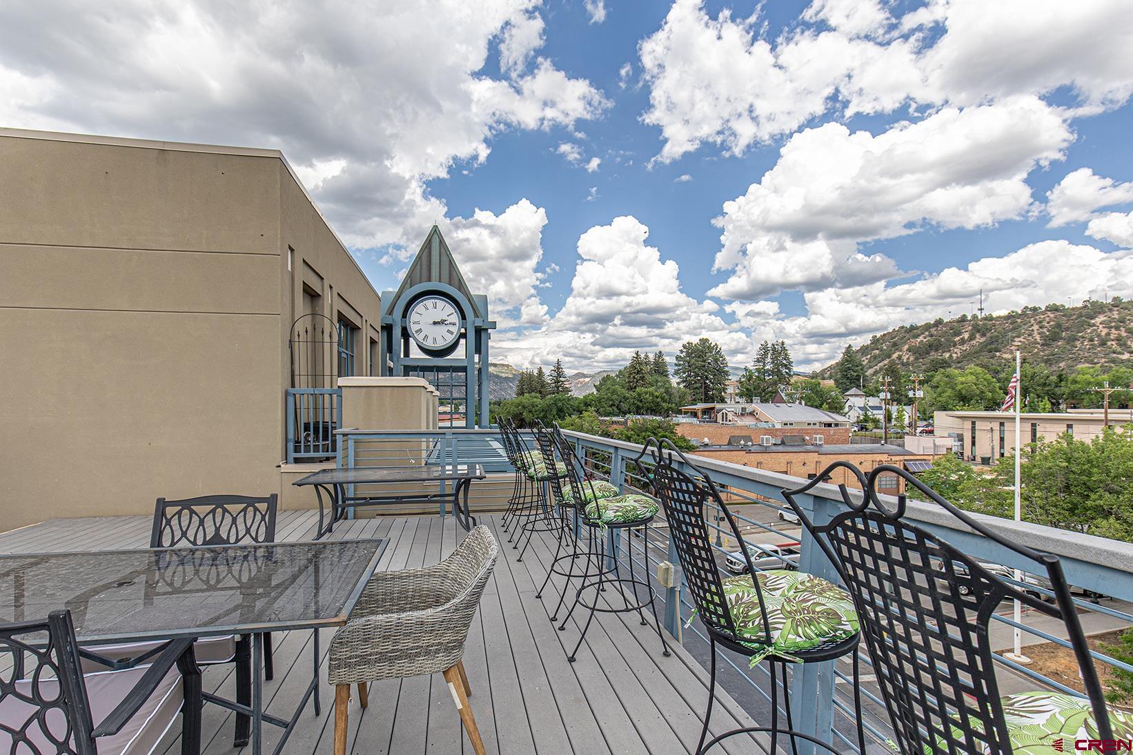 1099 Main Avenue, Unit 410 Durango, CO 81301 - Photo 25 of 34 a view of a chairs and table in patio