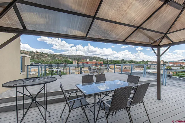 a table and chairs in front of a building