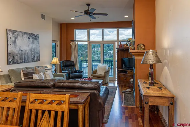 a kitchen with a sink appliances and wooden floor