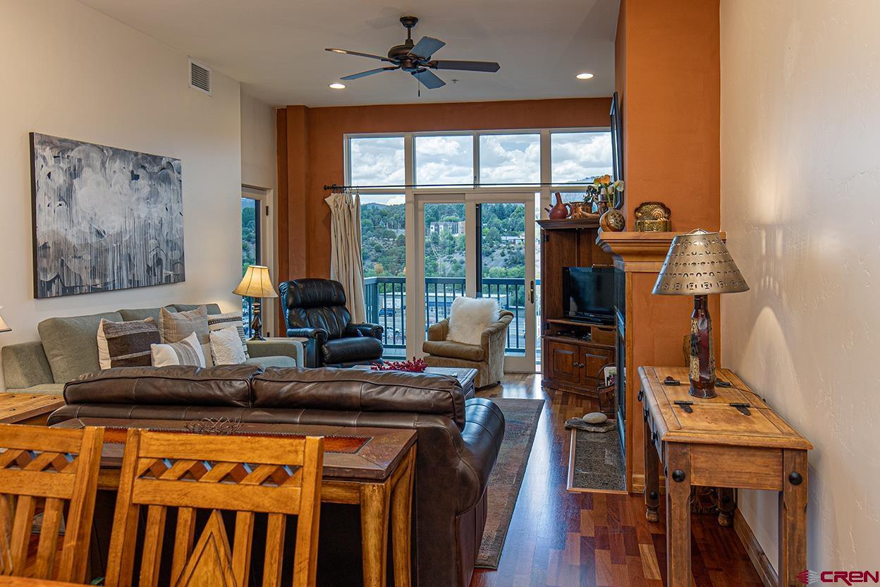 1099 Main Avenue, Unit 410 Durango, CO 81301 - Photo 5 of 34 a kitchen with a sink appliances and wooden floor