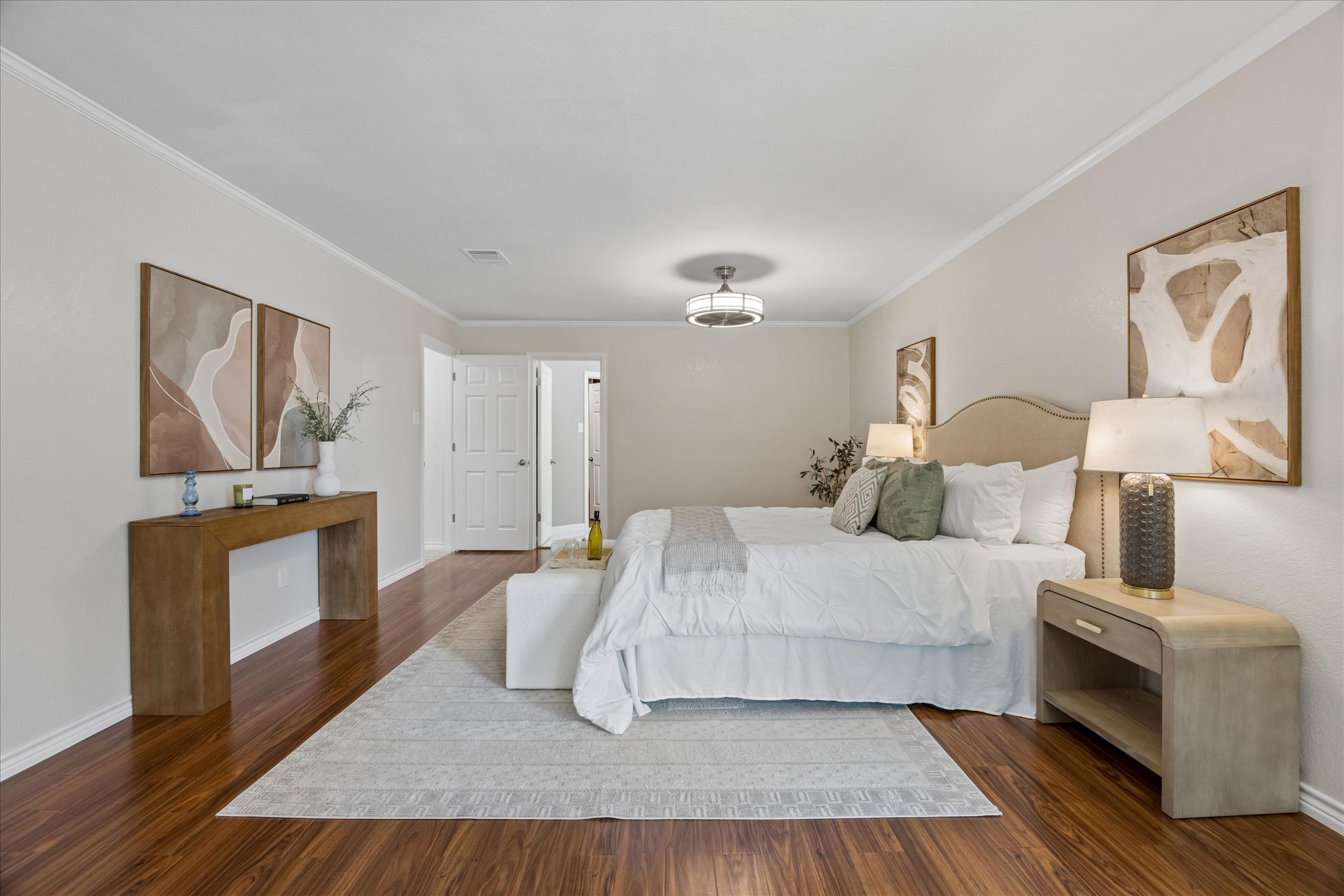 1306 Shady Grove Path Cedar Park, TX 78613 - Photo 19 of 40 a bedroom with a bed and wooden floor