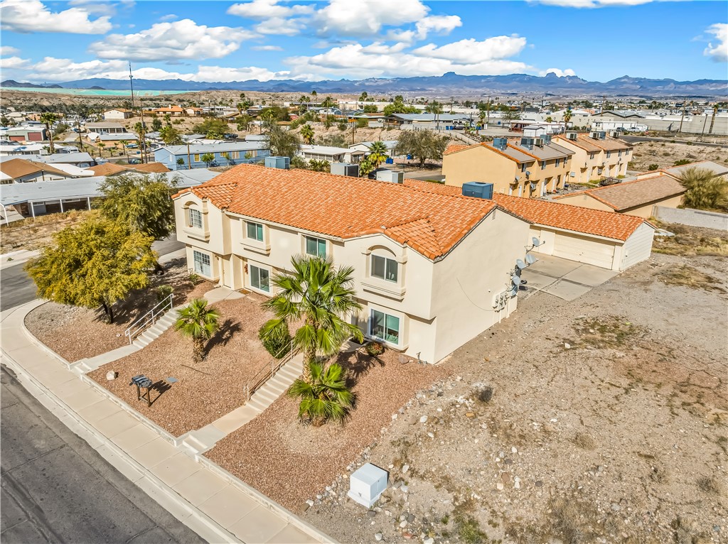 Aerial perspective of suburban area featuring mountains