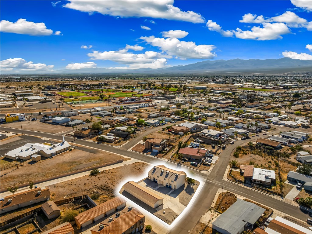 1666 Palma Road Bullhead City, AZ 86442 - Photo 18 of 22 Aerial perspective of suburban area featuring a mountainous background