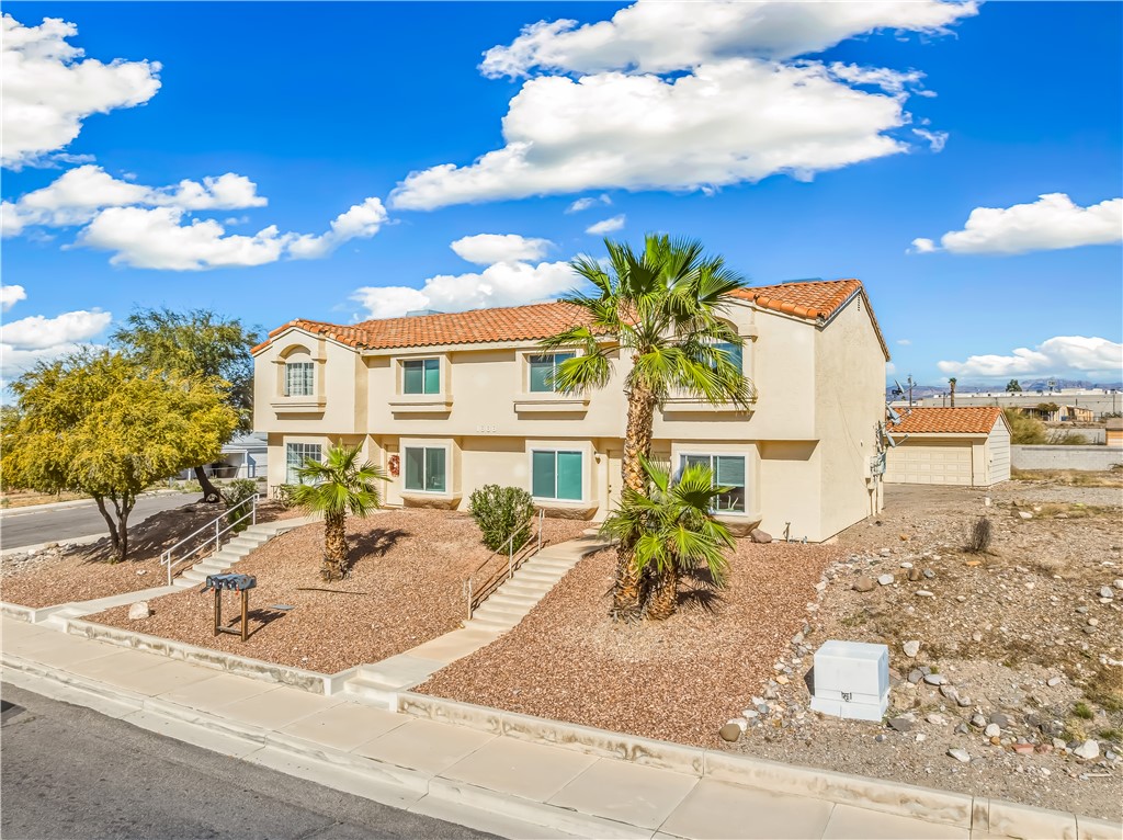 1666 Palma Road Bullhead City, AZ 86442 - Photo 2 of 22 Mediterranean / spanish house featuring a tiled roof and stucco siding