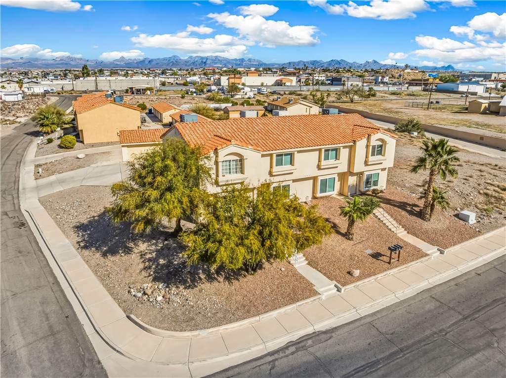 1666 Palma Road Bullhead City, AZ 86442 - Photo 3 of 22 View of front facade with a mountain view and a residential view