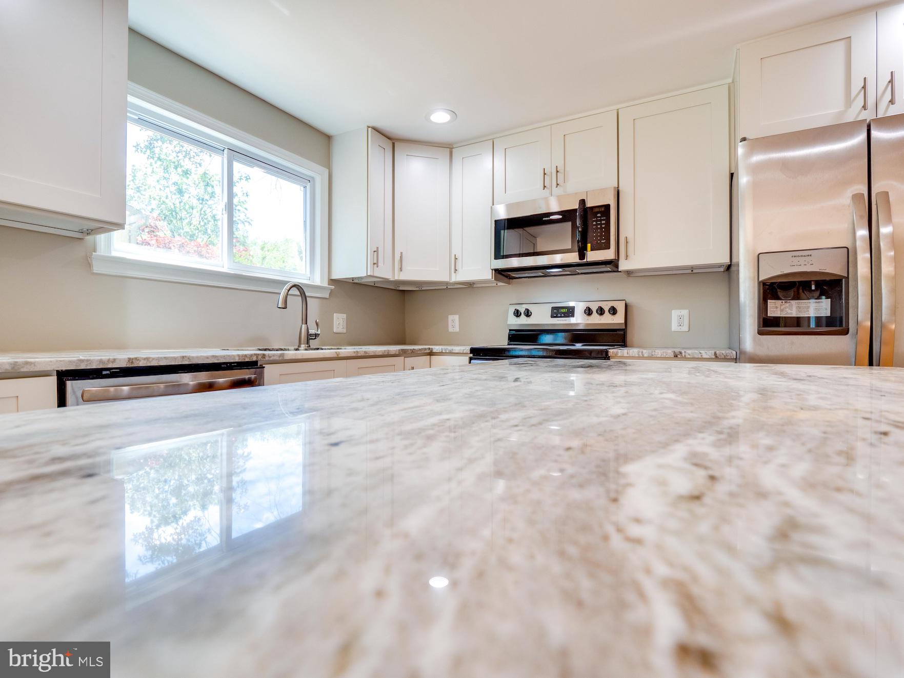 12276 Turkey Wing Court Reston, VA 20191 - Photo 4 of 39 White shaker cabinets w/ soft close drawers