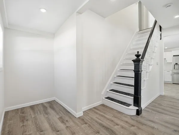 a view of entryway with wooden floor