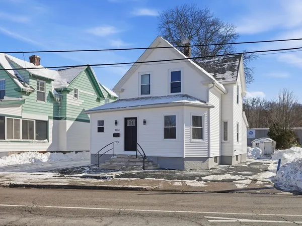 a view of a house with a road