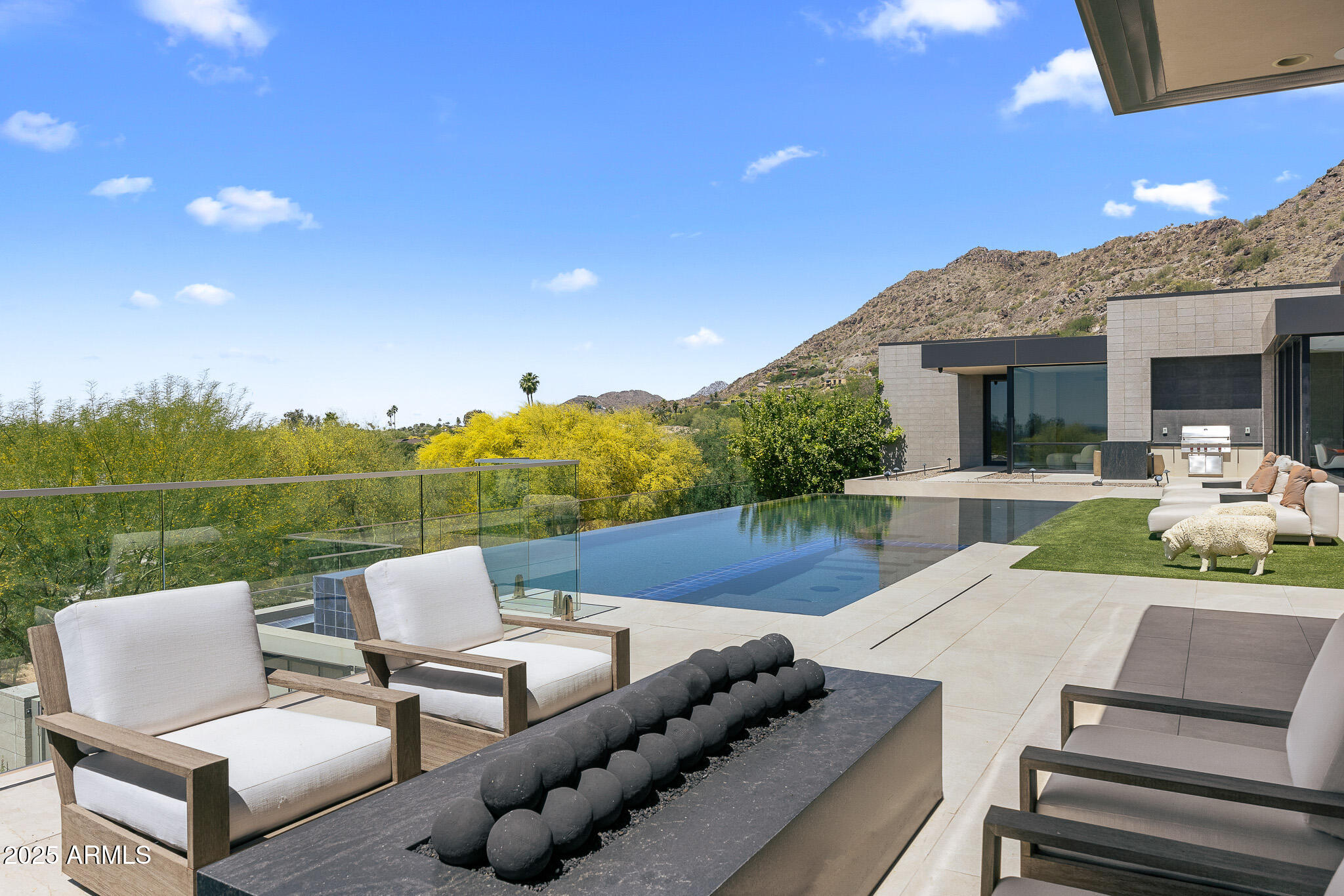 6149 East Indian Bend Road Paradise Valley, AZ 85253 - Photo 39 of 77 a view of a patio with couches chairs and a table
