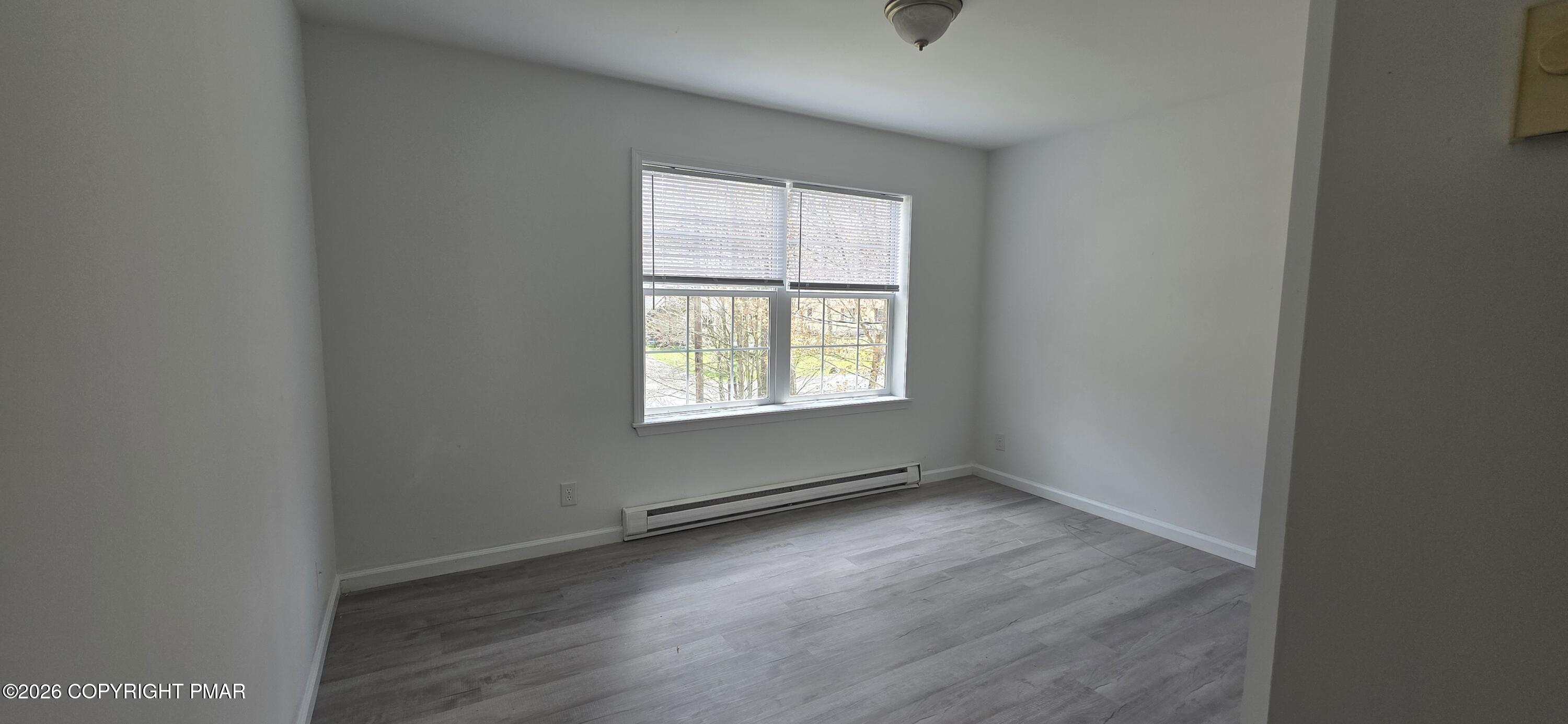 4715 Norwood Lane Tobyhanna, PA 18466 - Photo 13 of 14 an empty room with wooden floor and windows