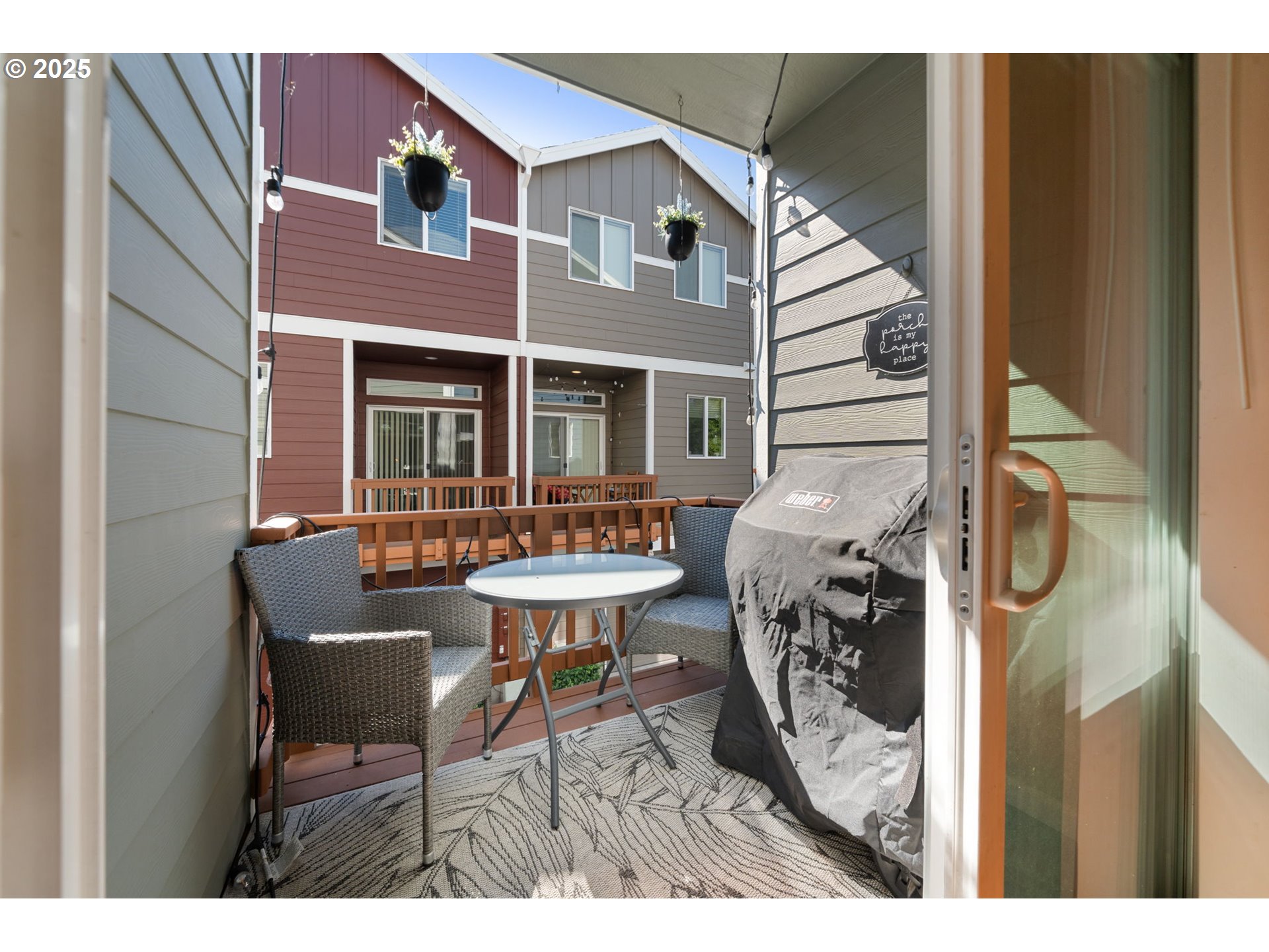 18292 Southwest Anna Mae Lane Beaverton, OR 97003 - Photo 17 of 34 a backyard of a house with table and chairs