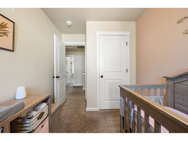 a spacious bedroom with a bed and a window
