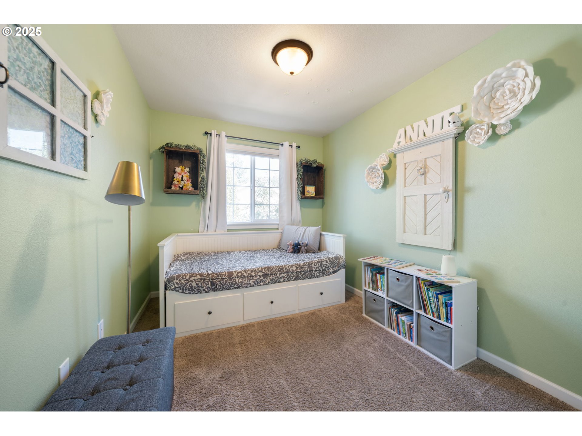 18292 Southwest Anna Mae Lane Beaverton, OR 97003 - Photo 21 of 34 a spacious bedroom with a bed and a window