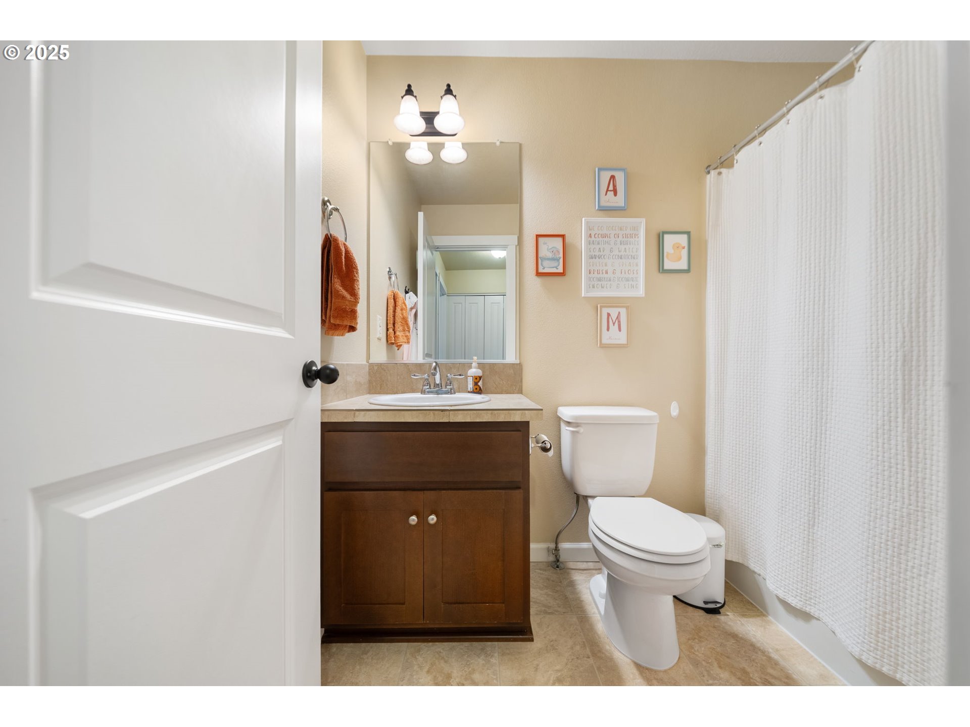 18292 Southwest Anna Mae Lane Beaverton, OR 97003 - Photo 22 of 34 a bathroom with a sink vanity mirror and toilet