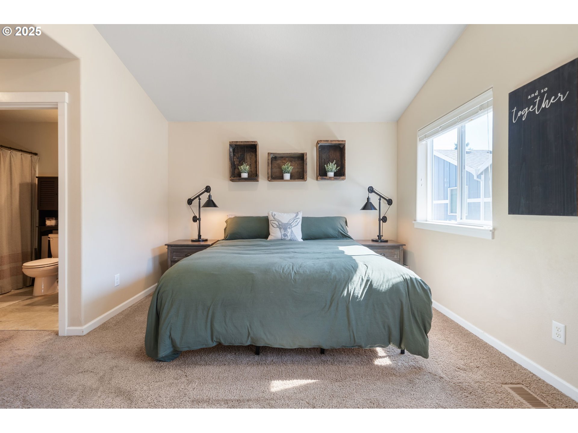 18292 Southwest Anna Mae Lane Beaverton, OR 97003 - Photo 24 of 34 a bedroom with a bed and a window