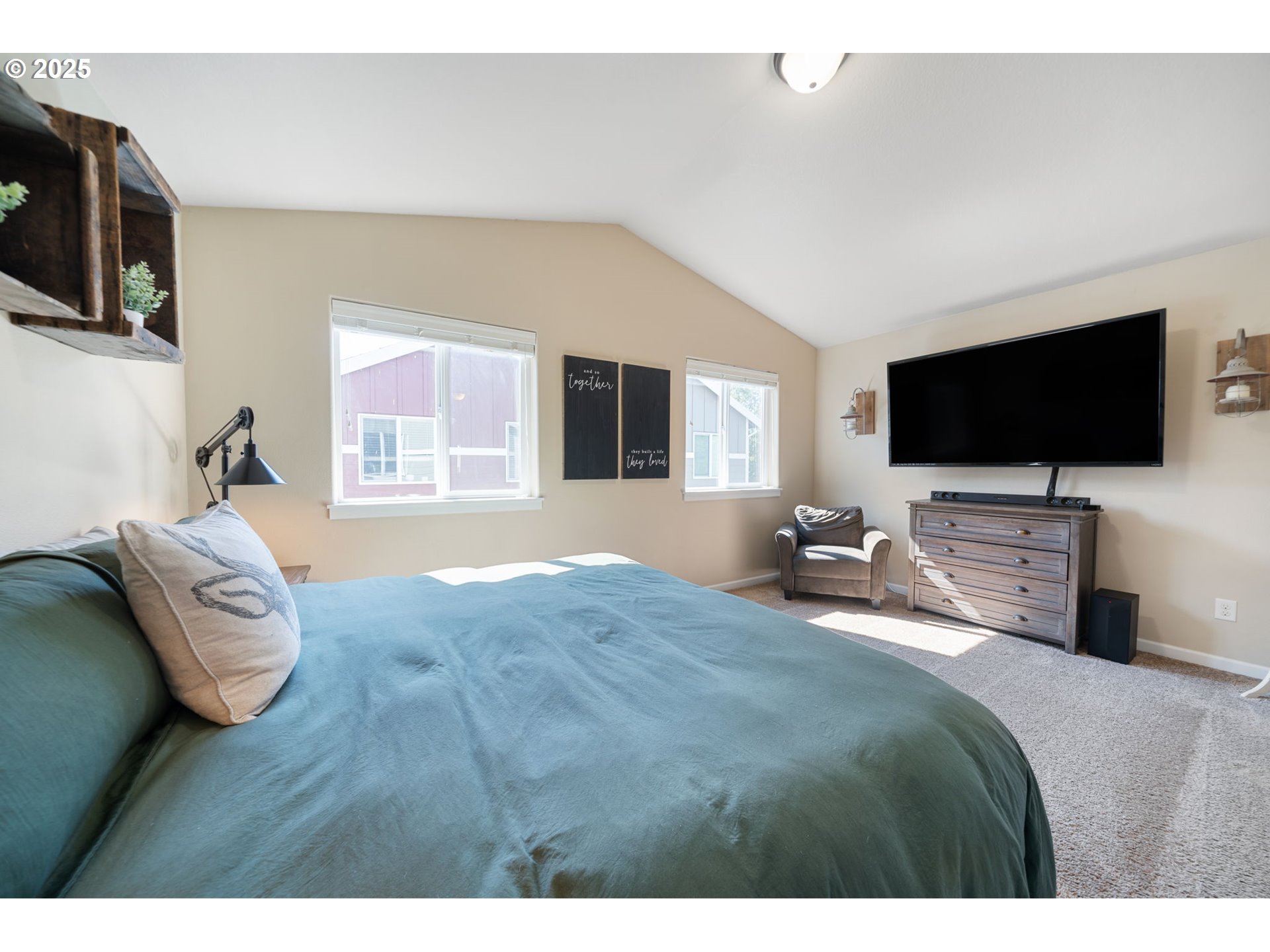 18292 Southwest Anna Mae Lane Beaverton, OR 97003 - Photo 26 of 34 a bedroom with a bed and a flat screen tv