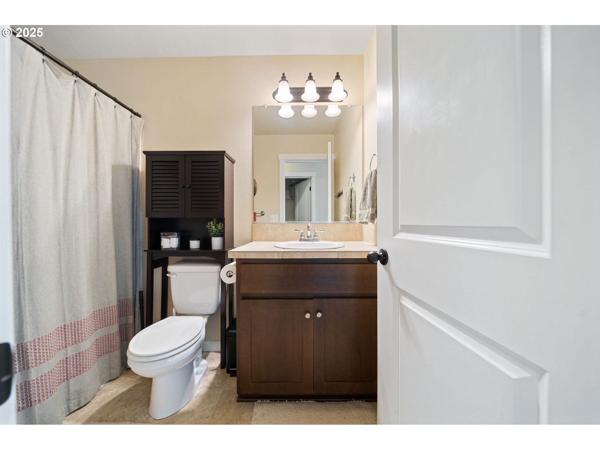 18292 Southwest Anna Mae Lane Beaverton, OR 97003 - Photo 27 of 34 a bathroom with a sink toilet and a mirror
