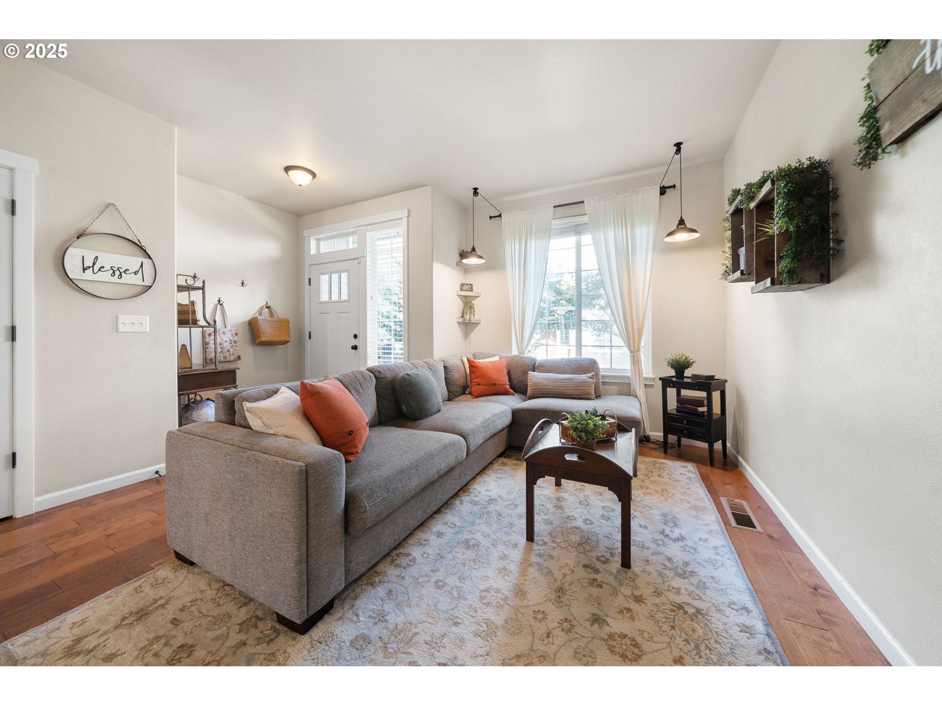 18292 Southwest Anna Mae Lane Beaverton, OR 97003 - Photo 5 of 34 a living room with furniture and a flat screen tv