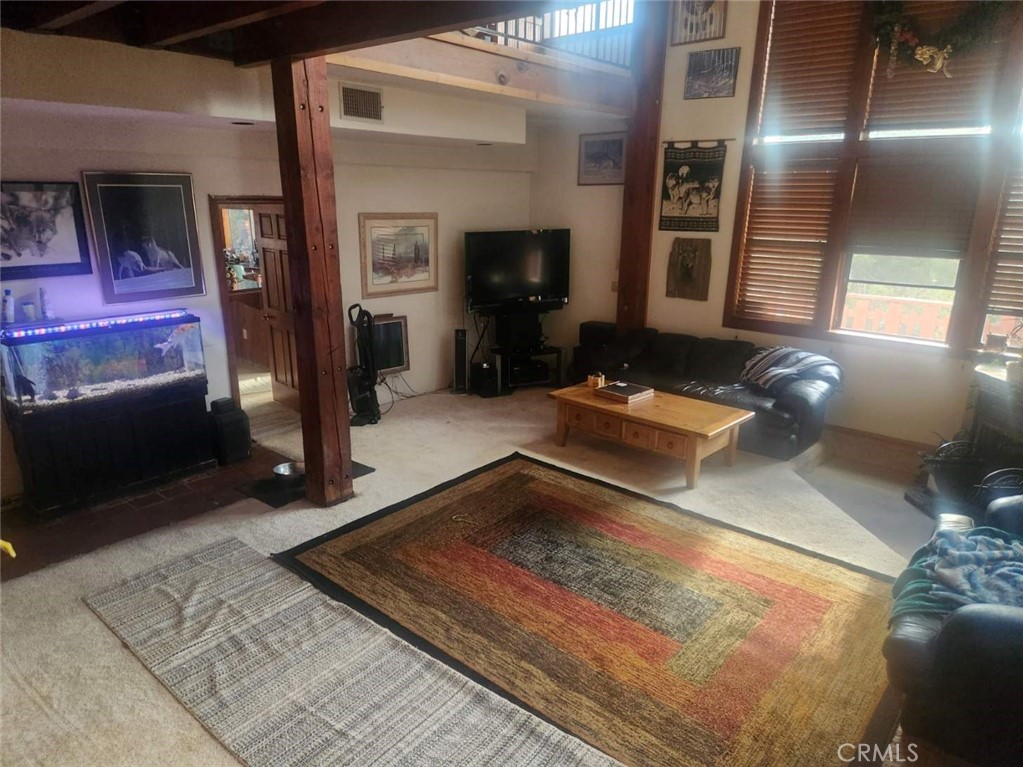 7404 Alpine Way Tujunga, CA 91042 - Photo 3 of 7 a living room with furniture and a flat screen tv